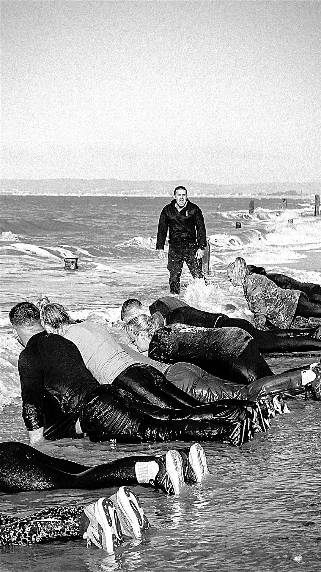 SPEARHEAD participants performing press-ups in the surf